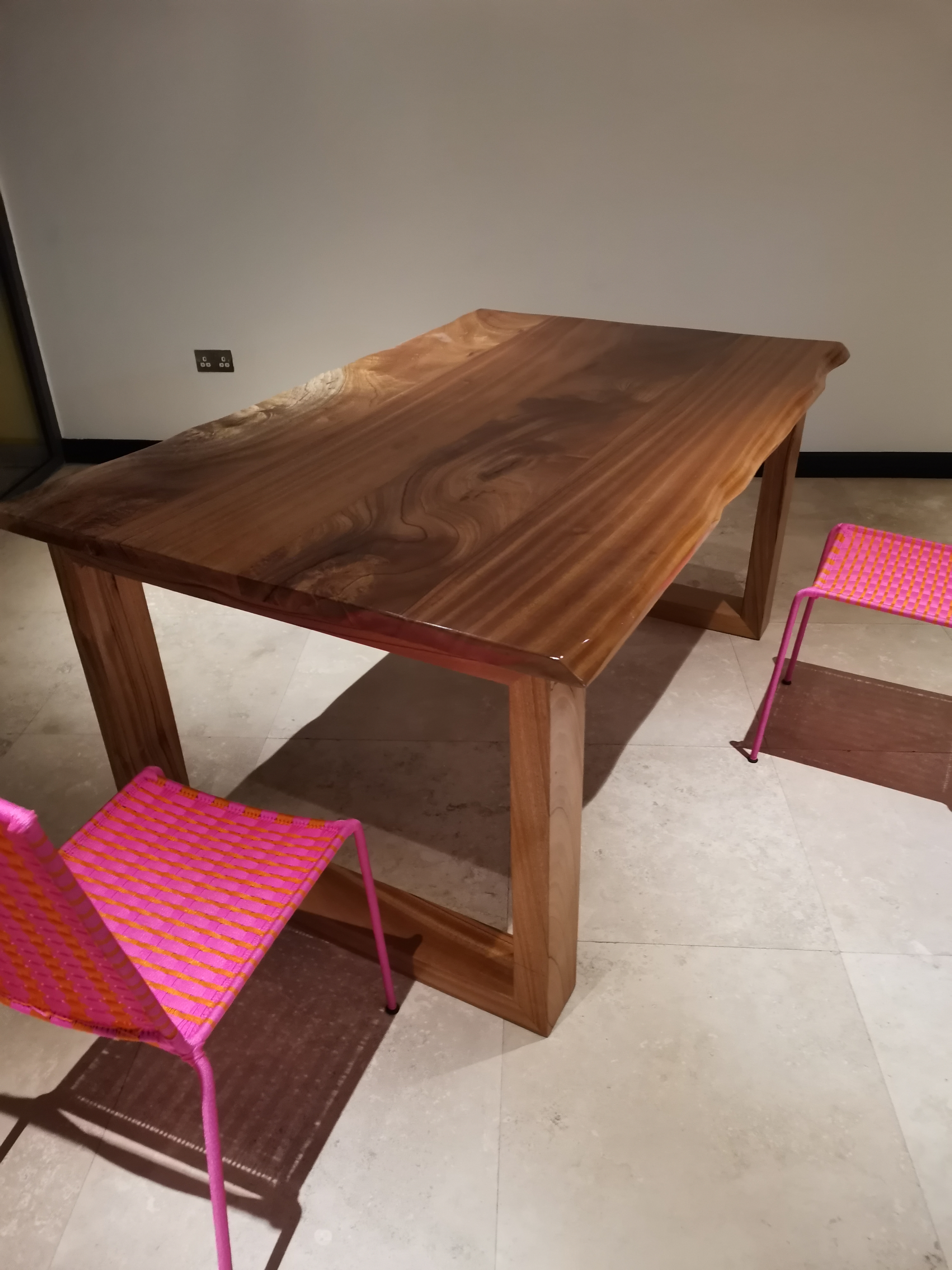 Afromosia dining table installed at the Ridge residence — angle view
