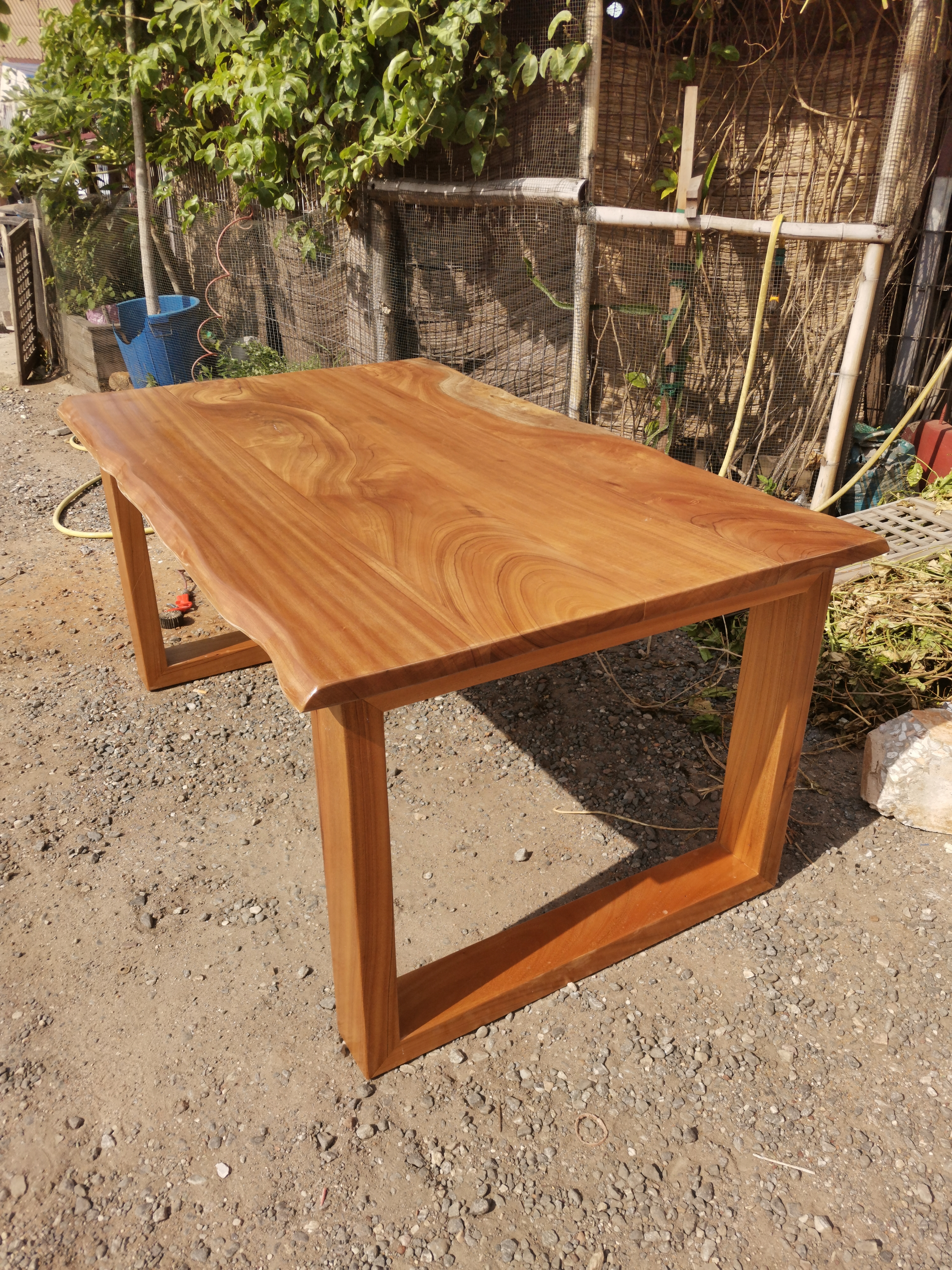 Afromosia live-edge dining table in the Neewoody workshop during build