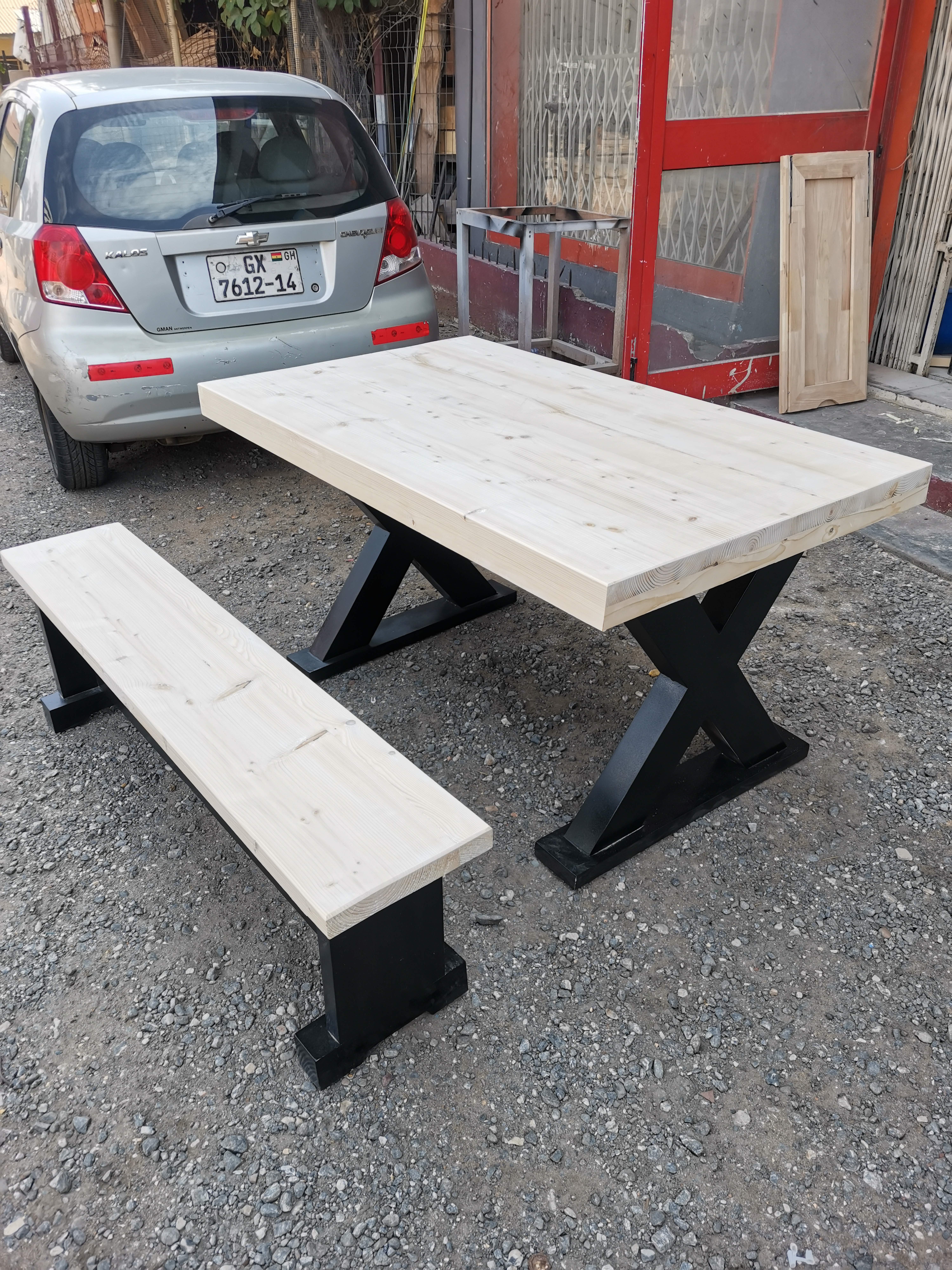 X-frame pine dining table and bench, freshly built and unstained, at the Neewoody workshop