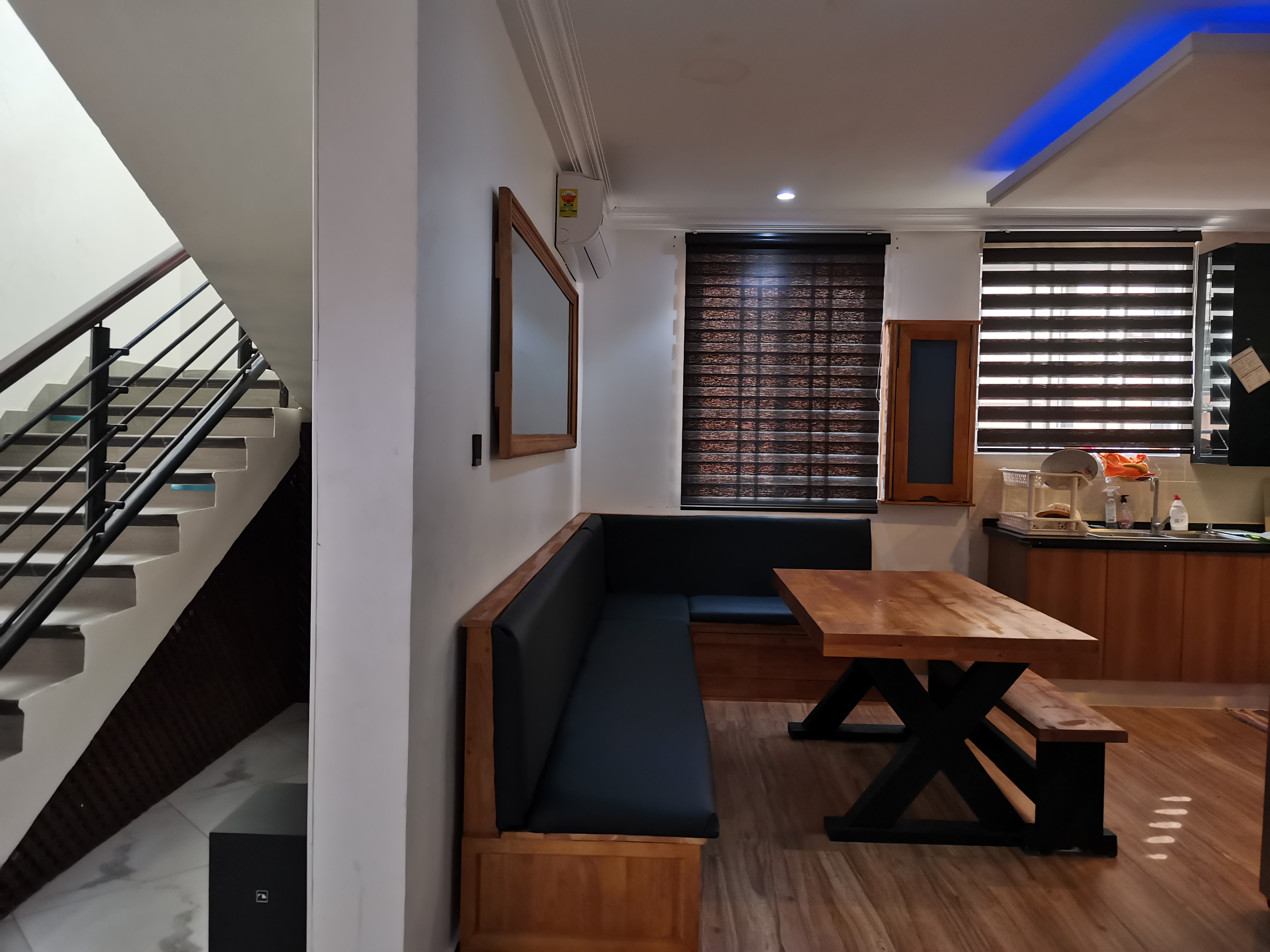 X-frame pine dining table and bench installed in Golf Hills Estate kitchen
