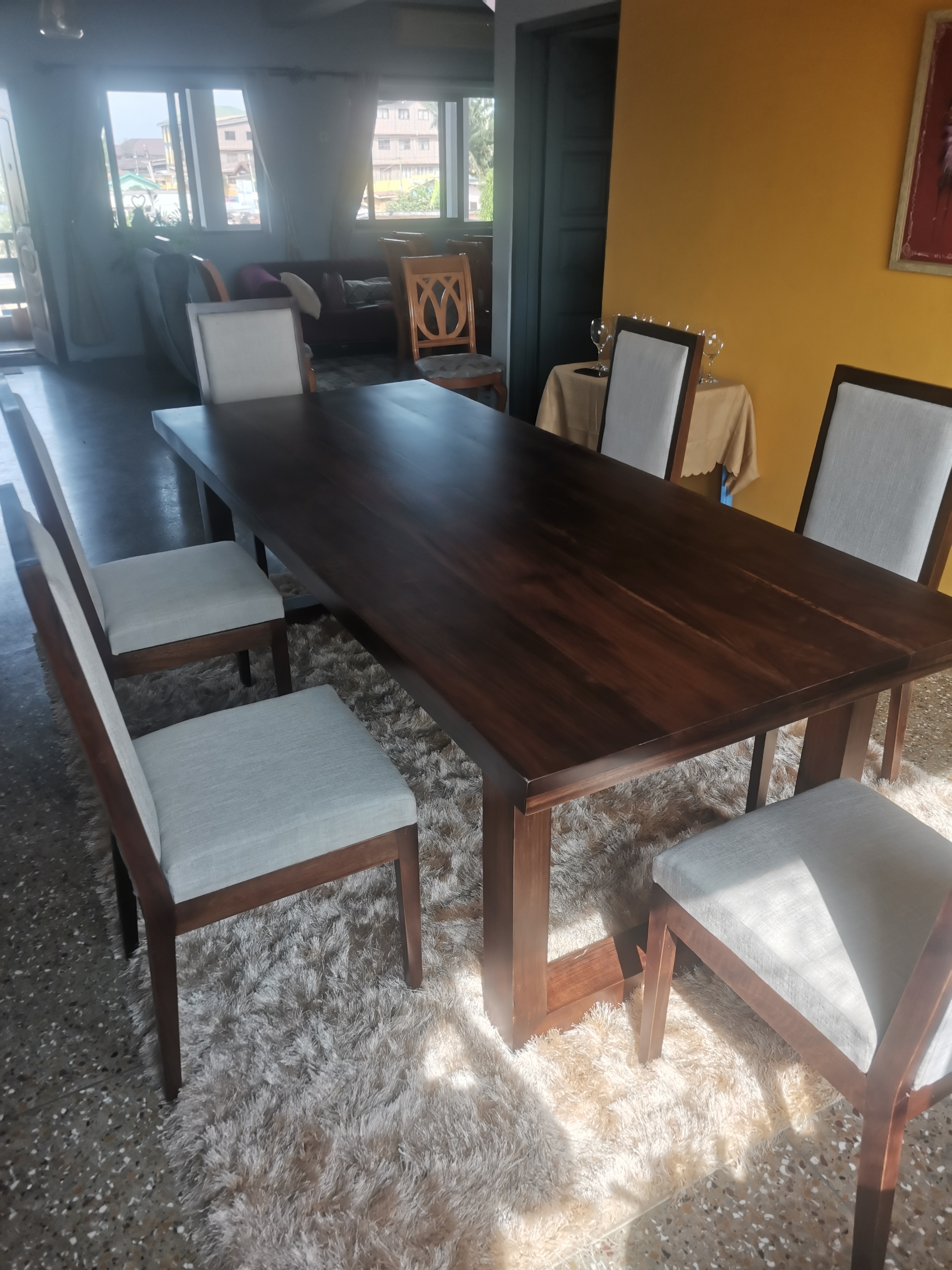 Hyedua dining table and chairs installed in East Legon home — full dining room commission by Neewoody Custom Woodwork