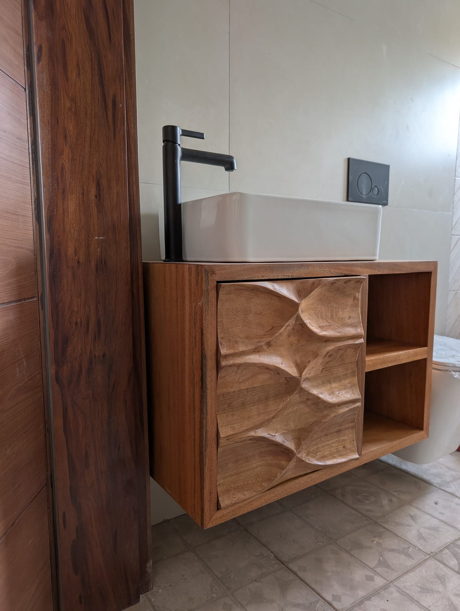 Khaya / African mahogany carved-door bathroom vanity, Spintex estate, Accra